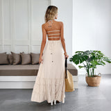 Abito donna con collo halter e gonna fluida a balze