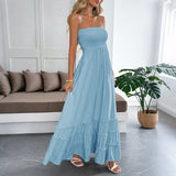 Abito donna con collo halter e gonna fluida a balze