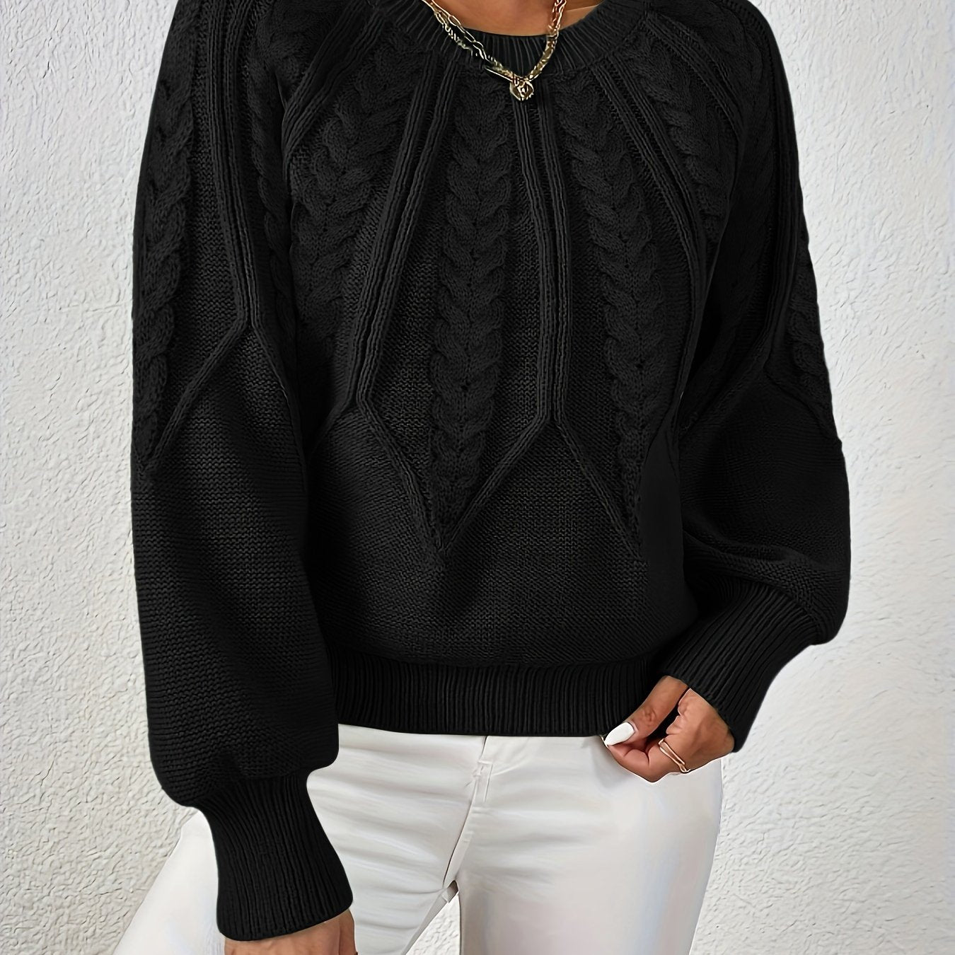 Maglione da donna con maniche voluminose e trama a trecce