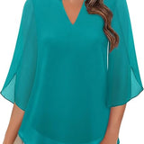 Blusa fluida con maniche a pipistrello – Eleganza e leggerezza