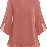 Blusa fluida con maniche a pipistrello – Eleganza e leggerezza