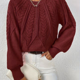 Maglione da donna con maniche voluminose e trama a trecce