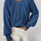 Maglione da donna con maniche voluminose e trama a trecce
