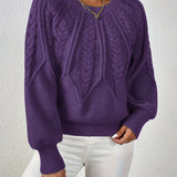 Maglione da donna con maniche voluminose e trama a trecce