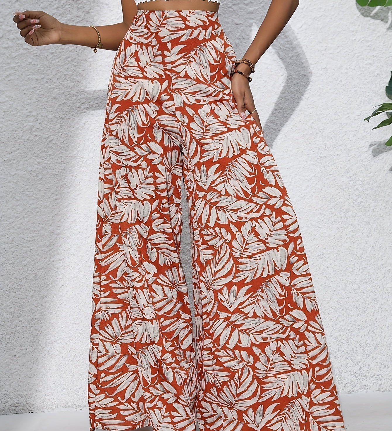 Pantaloni palazzo da donna a vita alta con stampa floreale - Fluidi ed eleganti