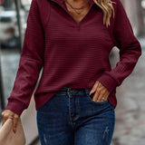 Maglione da donna a coste con mezza cerniera e collo rialzato