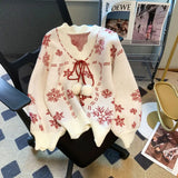Maglione natalizio da donna con scollo a V – Maglia con laccetti e pompon per look invernali festivi