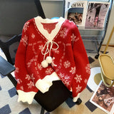 Maglione natalizio da donna con scollo a V – Maglia con laccetti e pompon per look invernali festivi