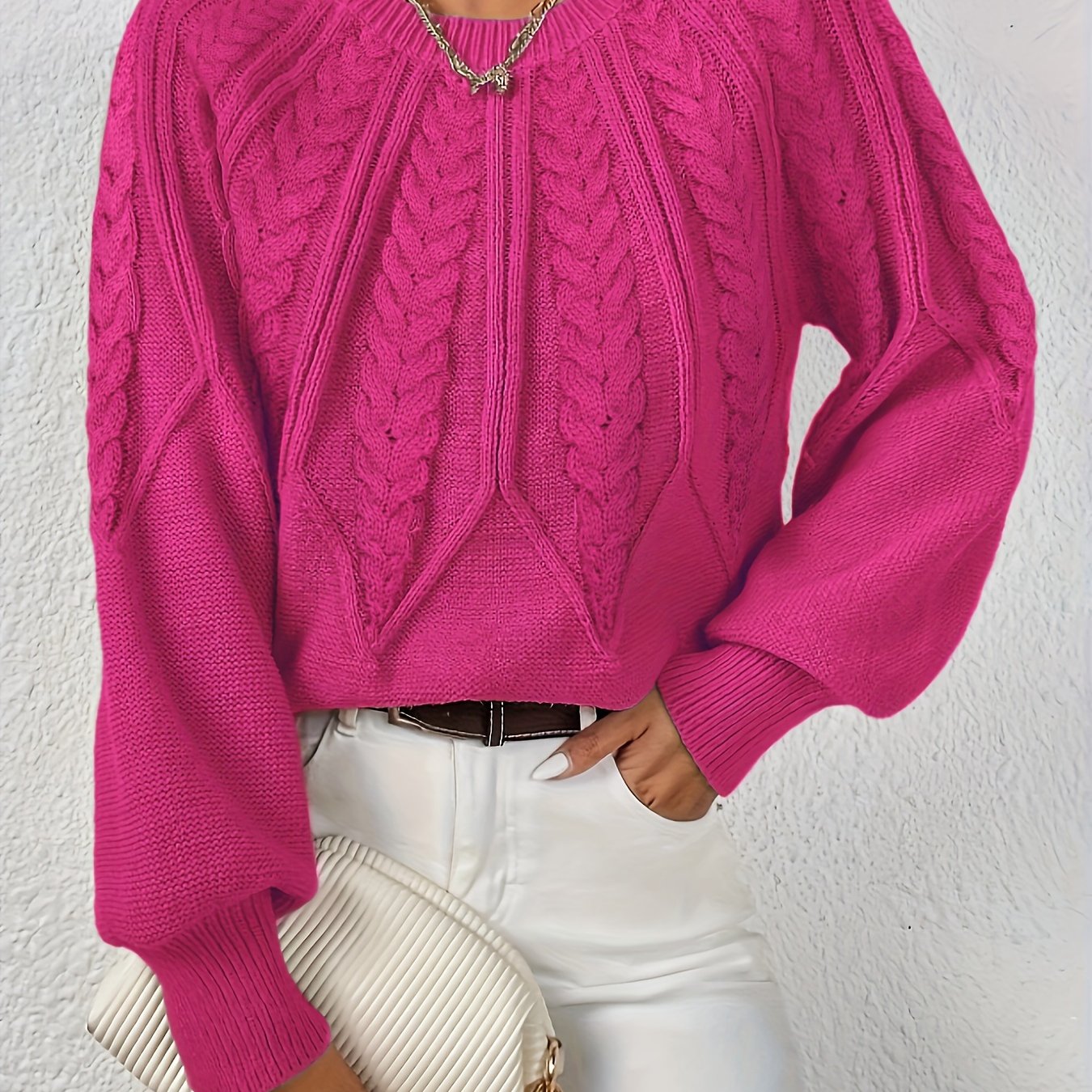 Maglione da donna con maniche voluminose e trama a trecce