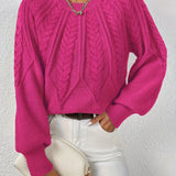 Maglione da donna con maniche voluminose e trama a trecce